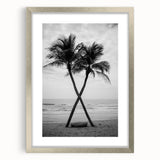 Textured art print of abstract palm trees in muted earth tones on a framed silver canvas, ideal for bedroom art.