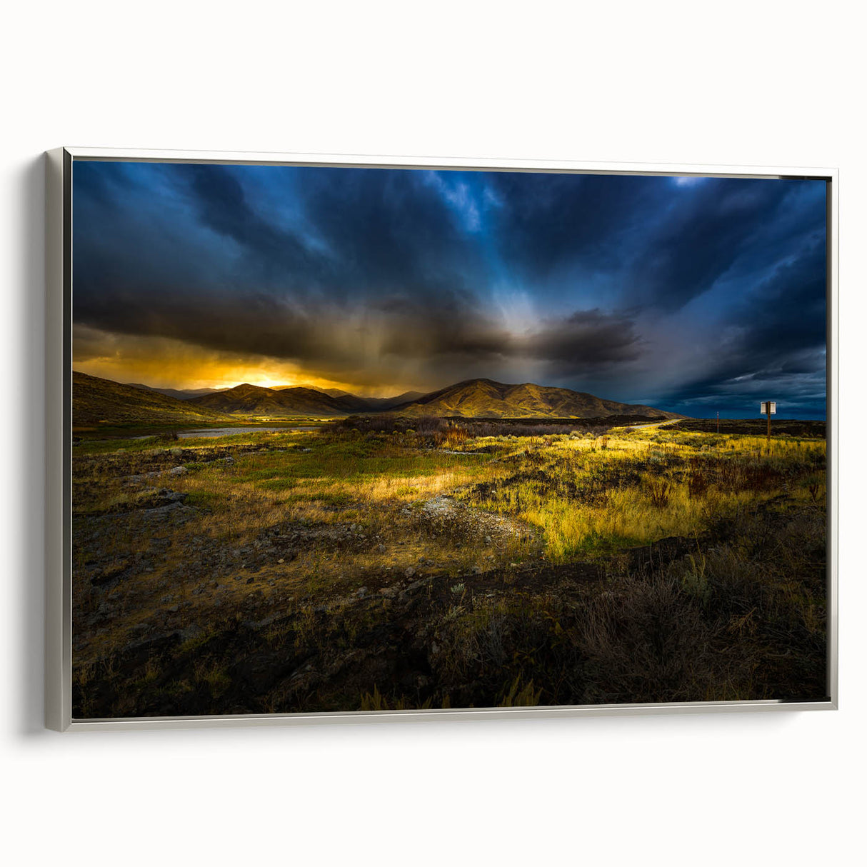 Framed canvas featuring a vintage-style Idaho landscape painting with vibrant colors on a black background.