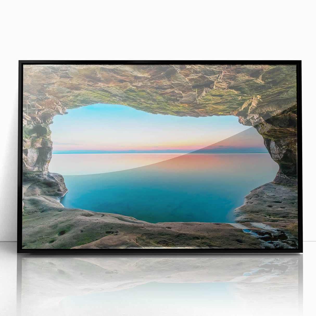 Large abstract wall art depicting Lake Michigan, in muted blue and gray, framed in black acrylic.