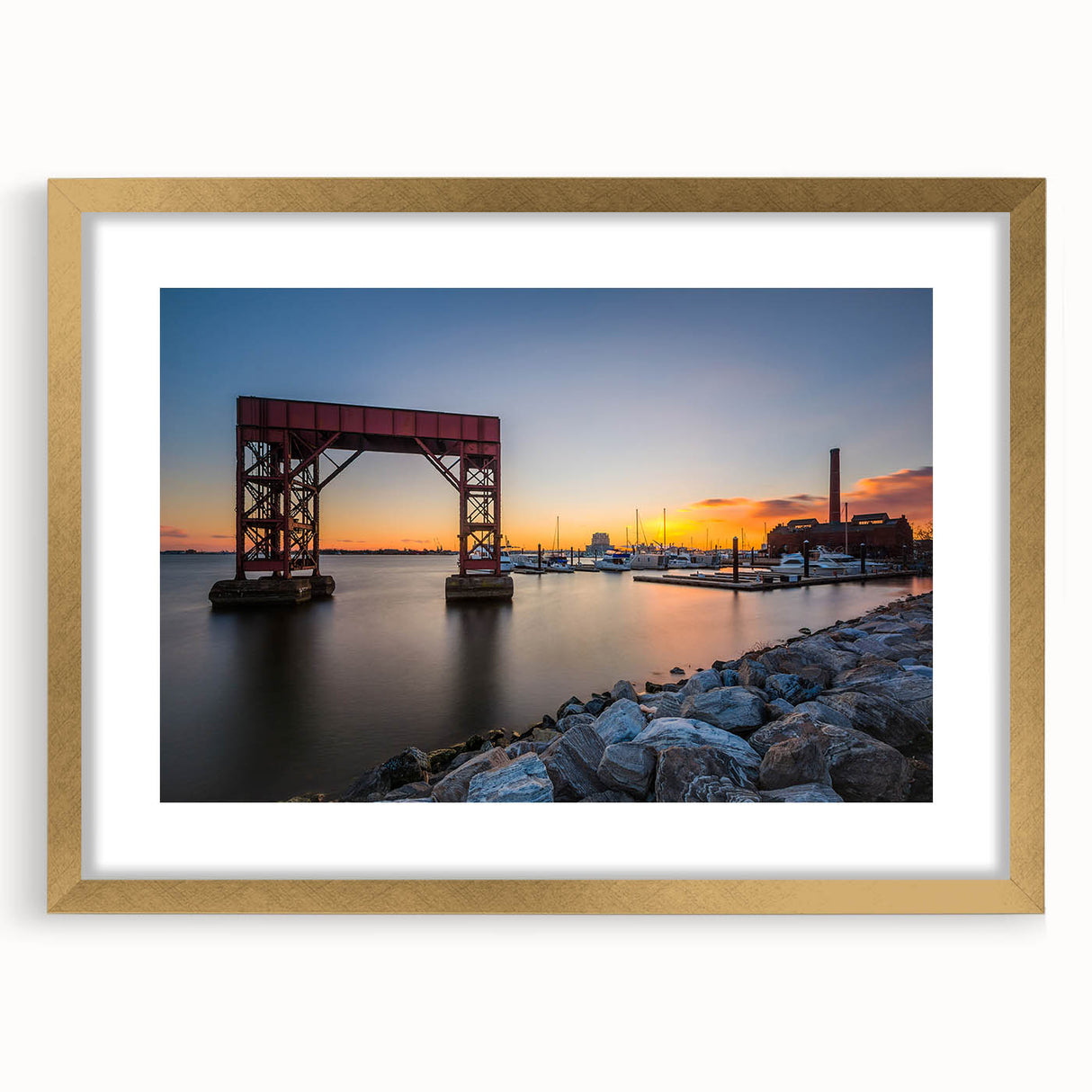 Extra large abstract art print of Baltimore skyline, featuring textured gold and blue hues on a framed canvas.