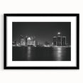 Abstract art print of Detroit skyline in vibrant colors on a large framed canvas, suitable for living room decor.