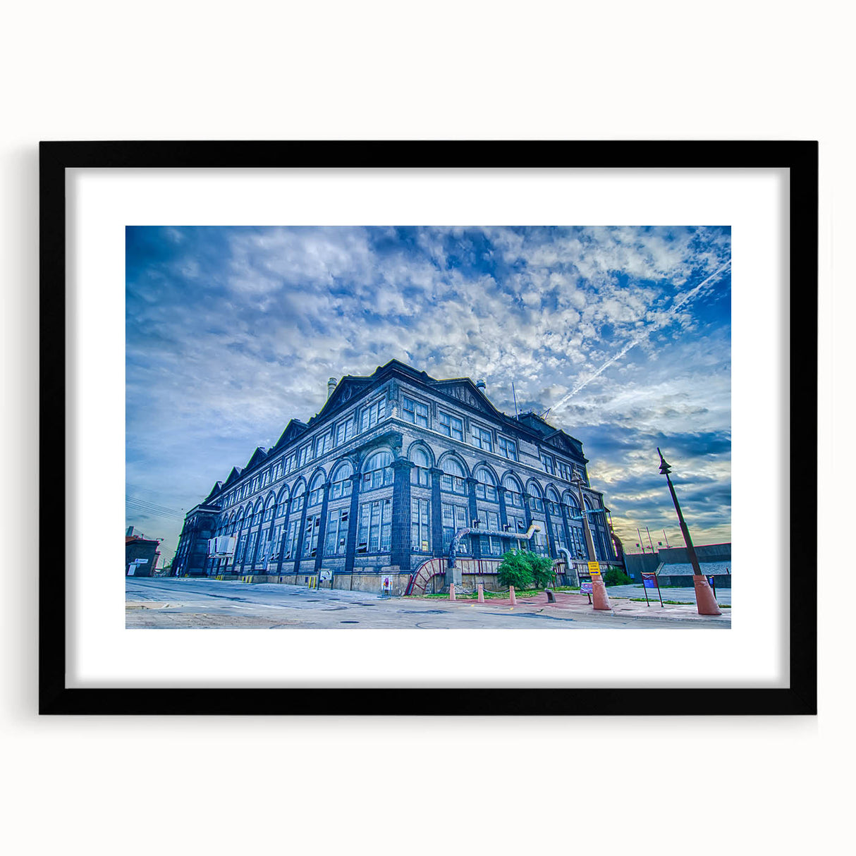 Abstract art print of St. Louis skyline in vibrant colors on a large textured canvas, suitable for living room decor.
