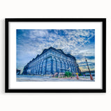 Abstract art print of St. Louis skyline in vibrant colors on a large textured canvas, suitable for living room decor.
