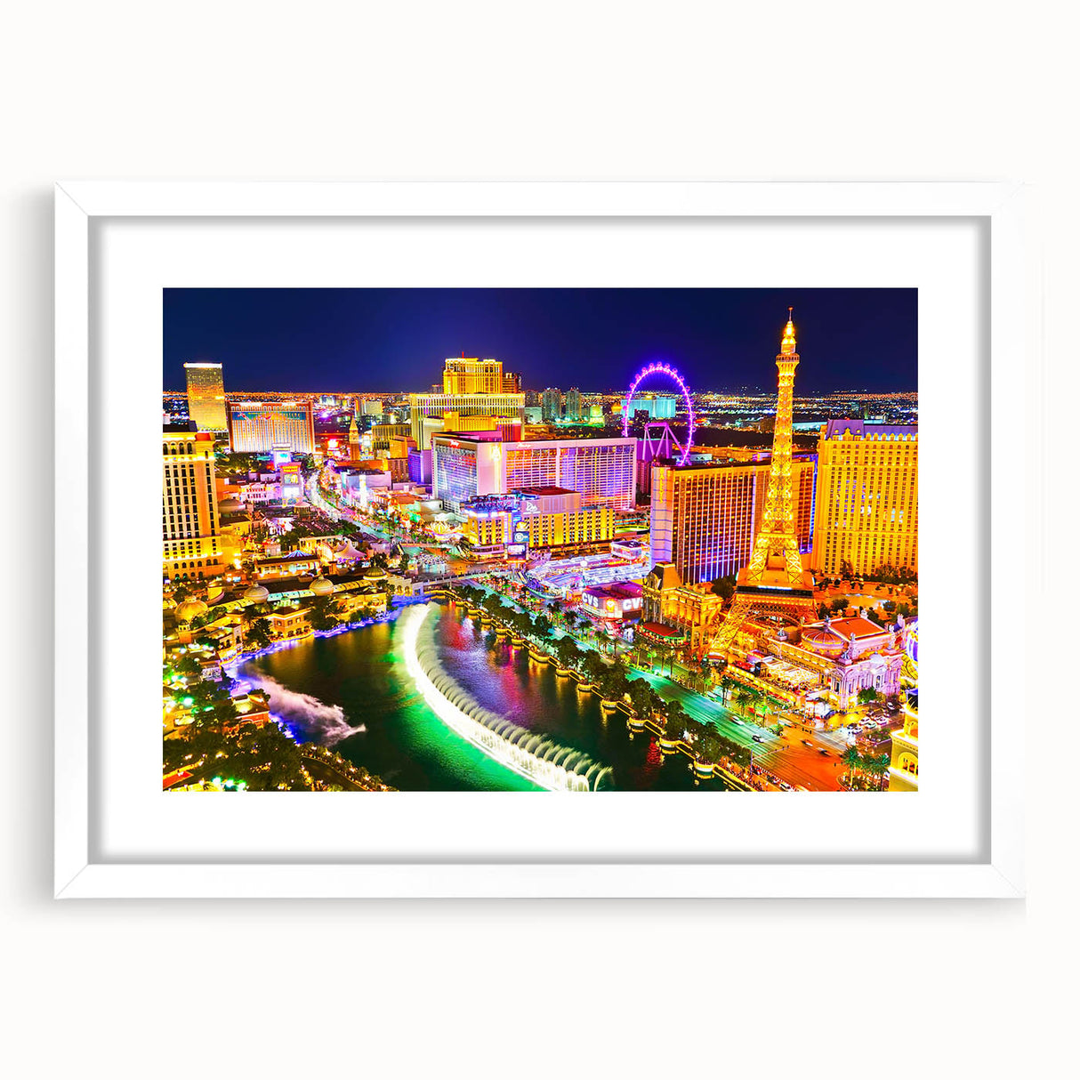 Abstract art print of the Las Vegas skyline in vibrant twilight hues on a framed white mat, suitable for dining room decor.
