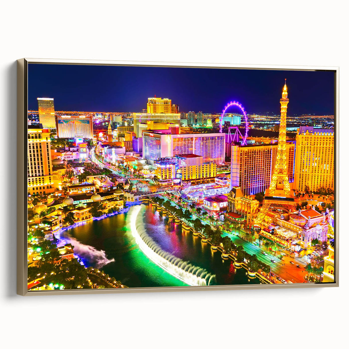 Framed canvas depicting the Las Vegas skyline in vintage poster style, featuring a black and gold color palette.
