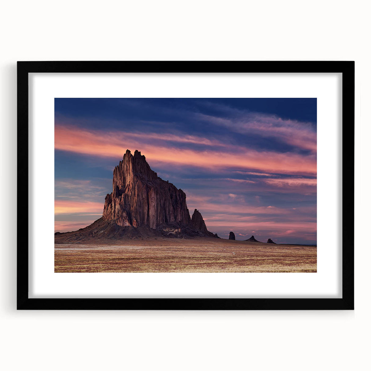 Extra large abstract art print depicting the White Sands of New Mexico in colorful, textured hues on a framed black mat.