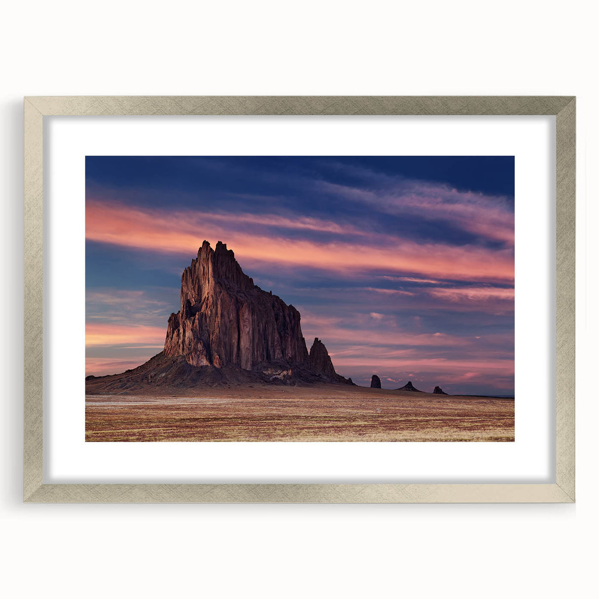 Textured art print of abstract White Sands, New Mexico scenery in muted earth tones, framed in silver, ideal for bedroom art.