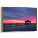 Framed canvas depicting a vintage-style landscape of the Outer Banks in North Carolina, featuring muted gold and black tones.