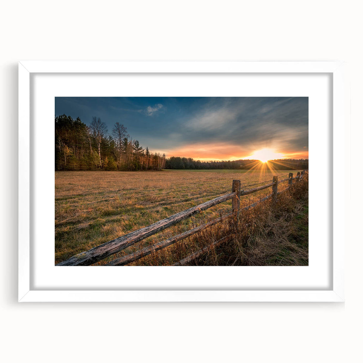Abstract art print of Adirondacks scenery in muted greens and blues, framed in white, suitable for dining room decor.