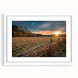 Abstract art print of Adirondacks scenery in muted greens and blues, framed in white, suitable for dining room decor.