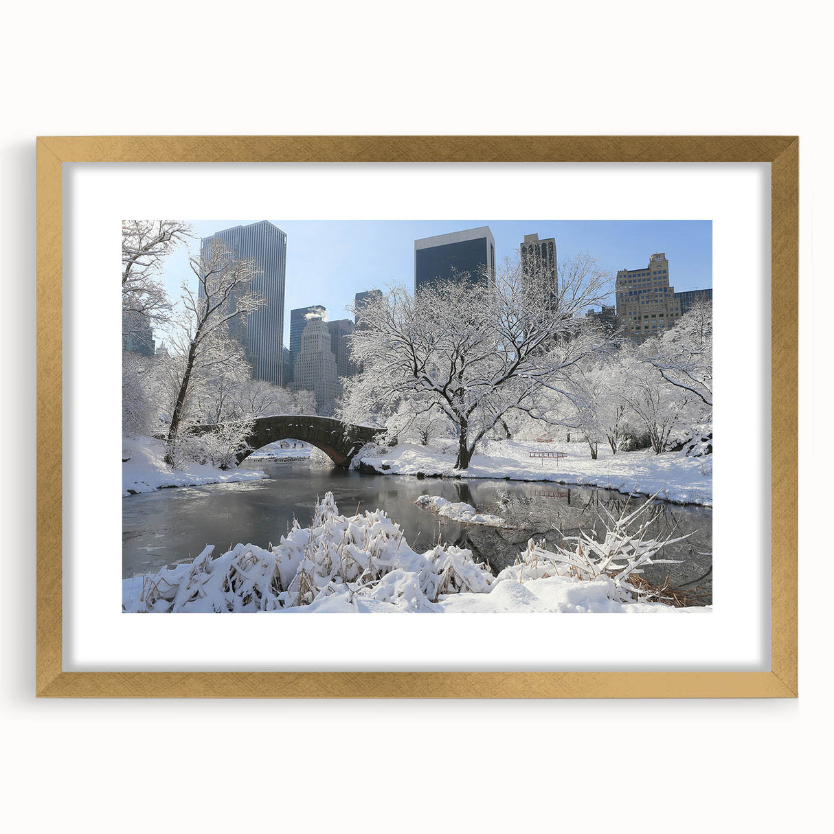 Extra large abstract art print of Central Park with textured design in muted greens and browns, framed in gold.