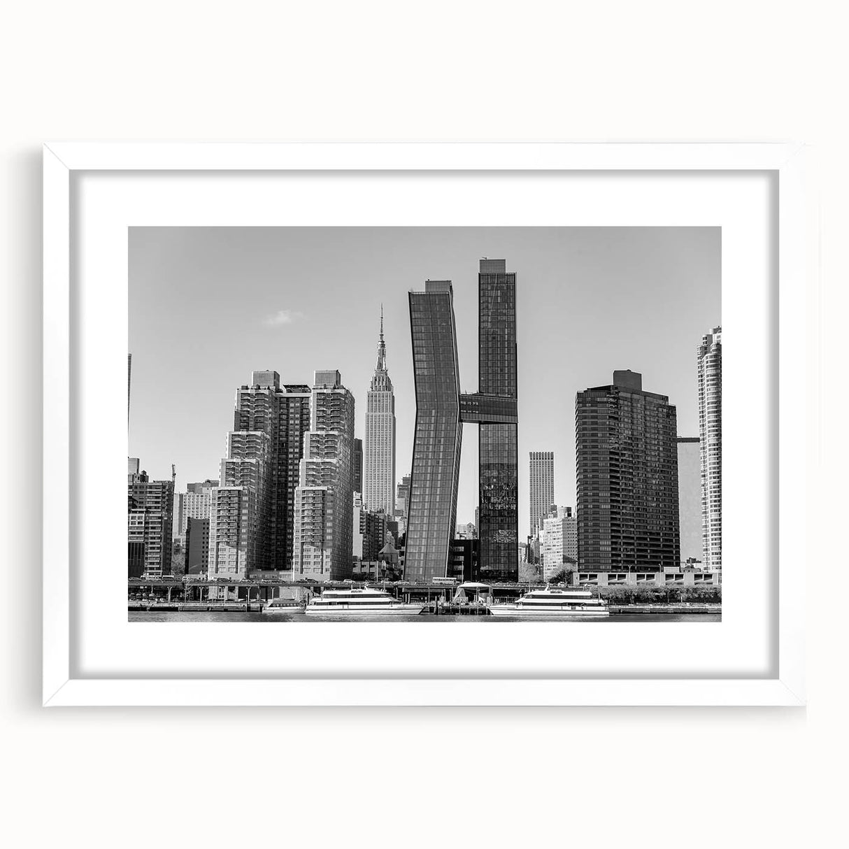 Abstract art print of the Chrysler Building in muted gray tones, framed with a white mat.