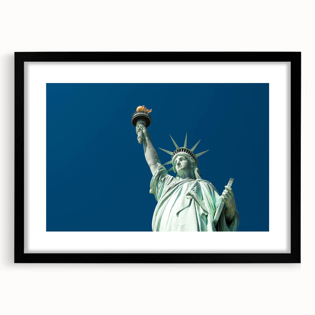 Abstract depiction of the Statue of Liberty in vibrant, colorful tones on a large, textured canvas.