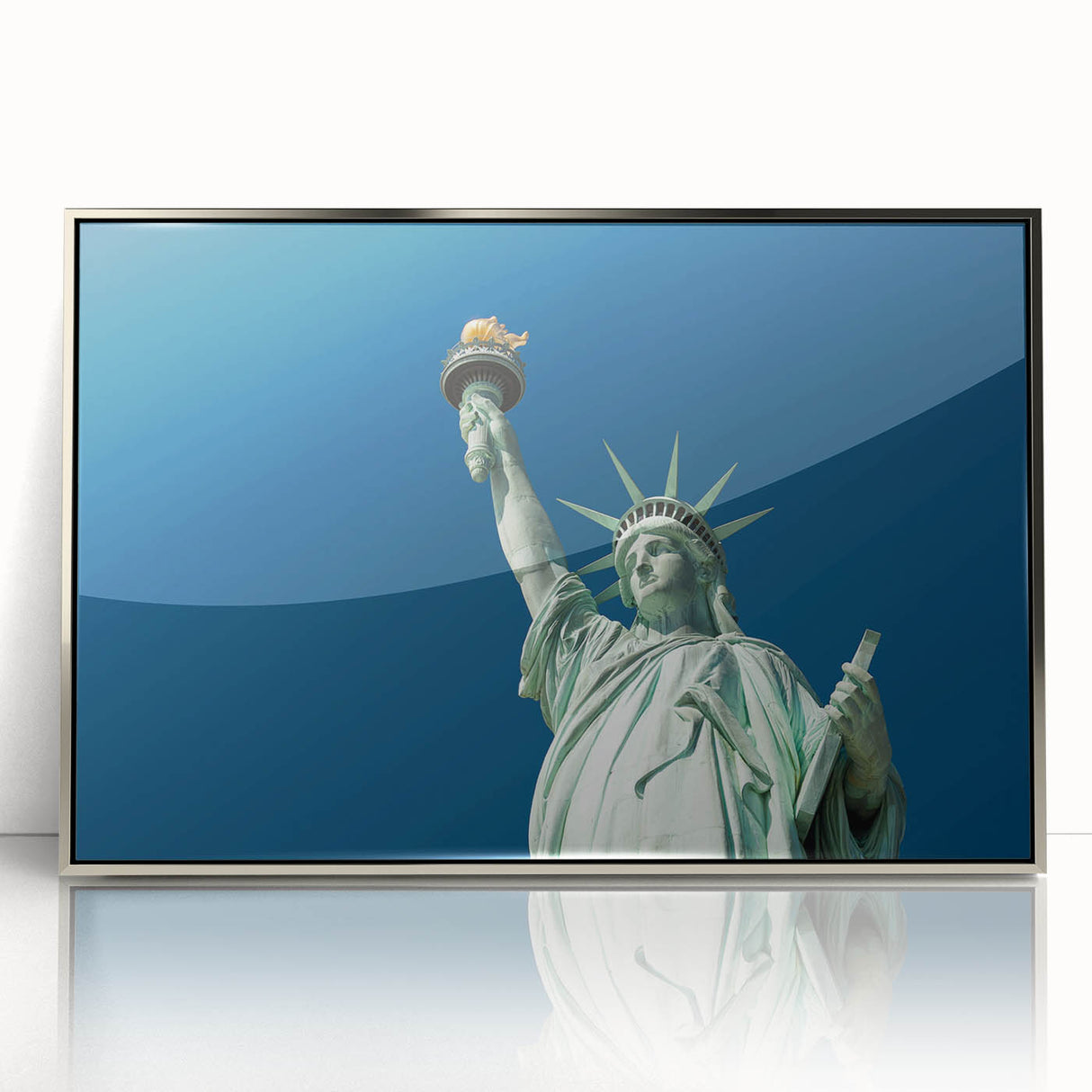 Mid-century modernist art of the Statue of Liberty in muted gray tones on a silver-framed acrylic print.