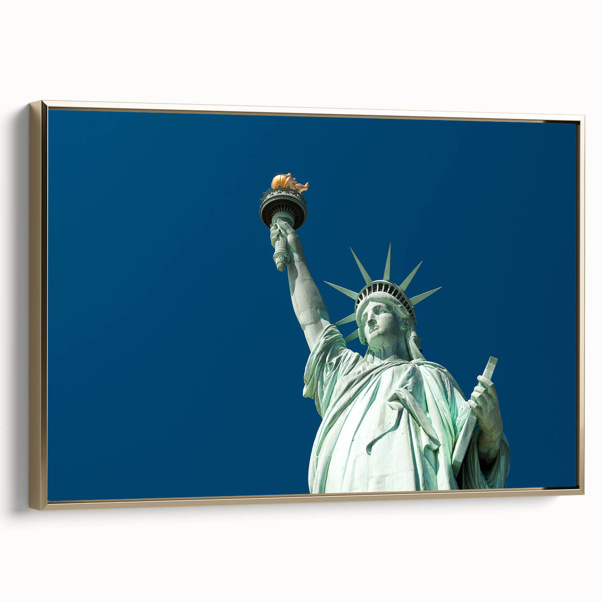 Framed canvas featuring a side view of the Statue of Liberty in black and gold tones, ideal for bedroom wall art.