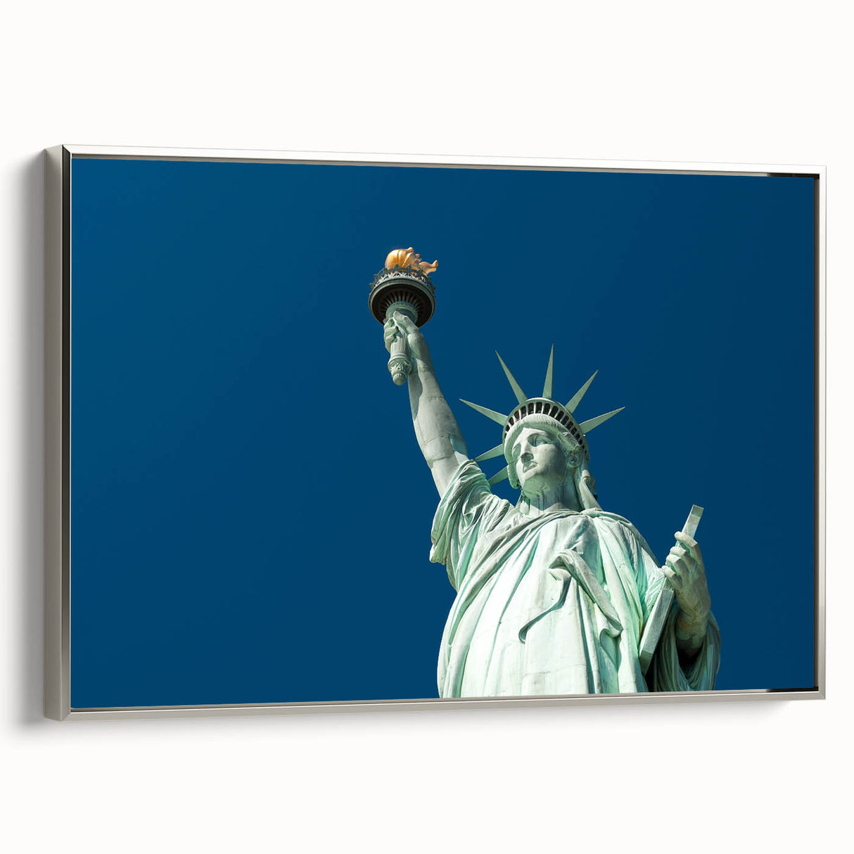 Framed canvas of the Statue of Liberty in a vintage poster style, featuring a black and colorful palette.
