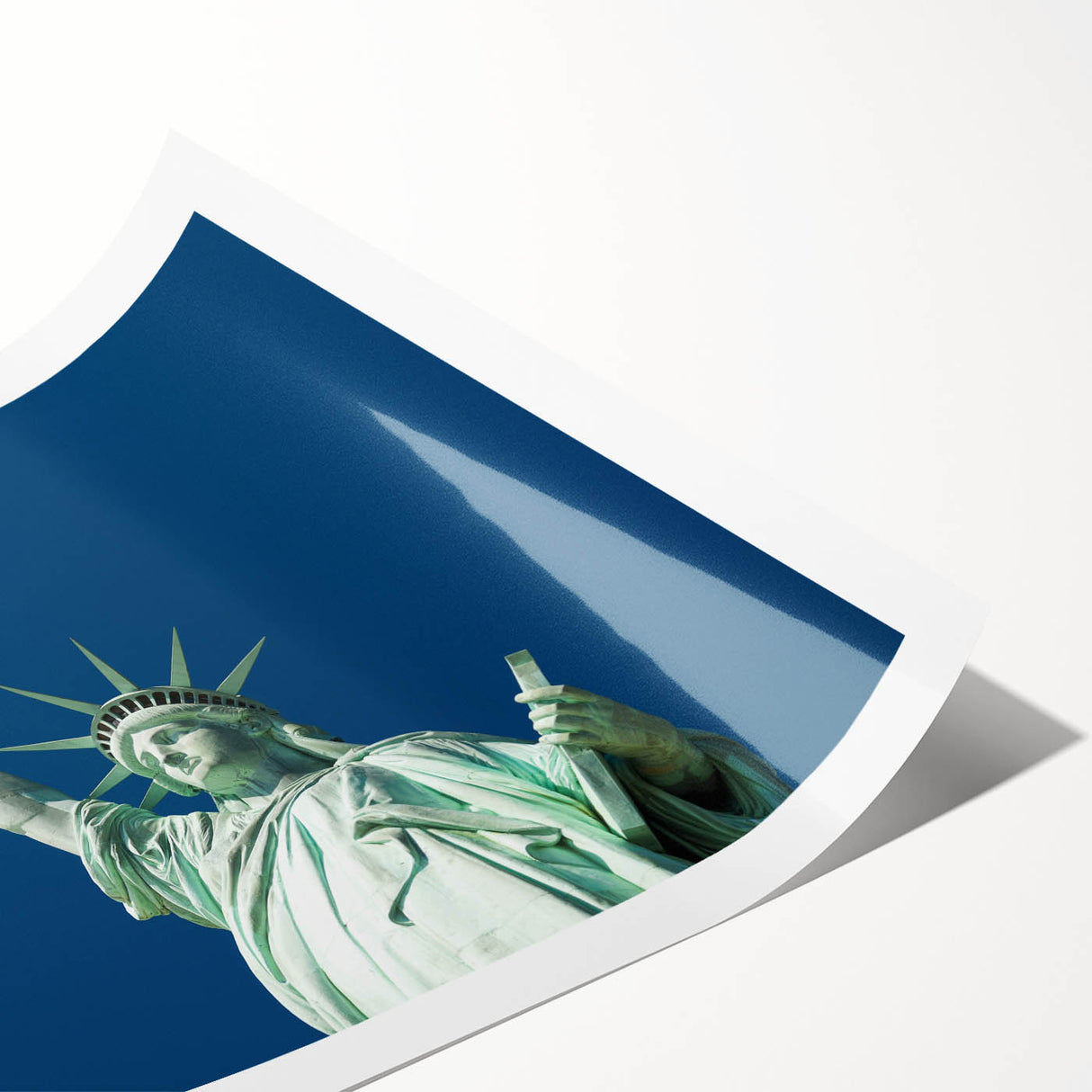 Extra large wall art featuring a line art design of the Statue of Liberty, in black on a white rolled canvas.
