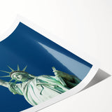 Extra large wall art featuring a line art design of the Statue of Liberty, in black on a white rolled canvas.