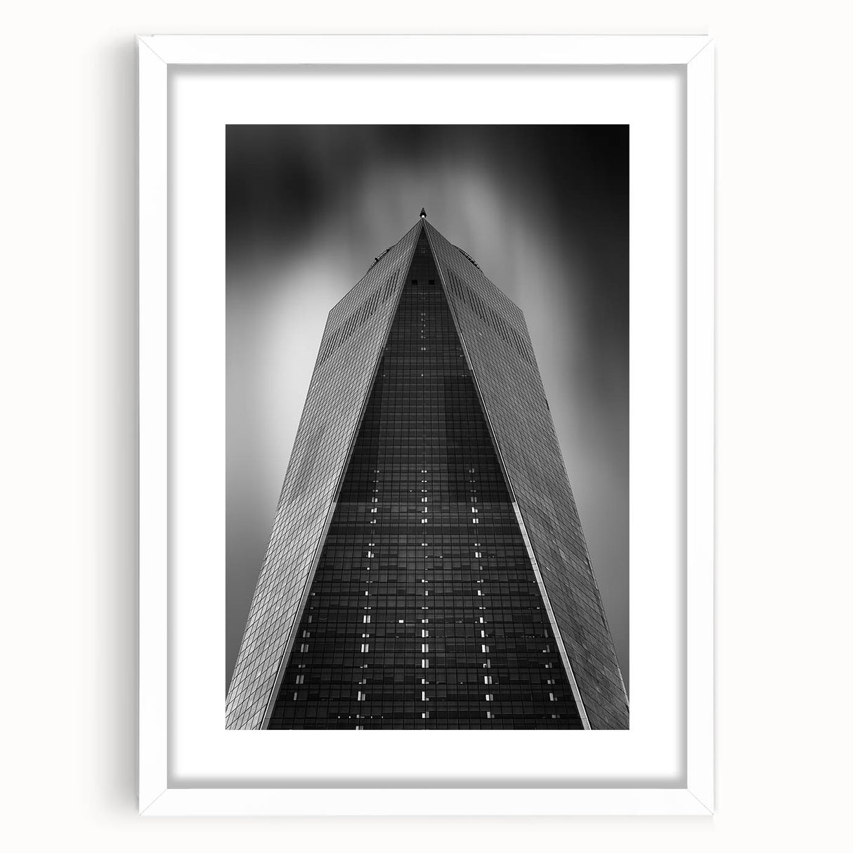 Abstract art print of NYC skyline in muted gray and blue tones on a white framed poster, suitable for dining room decor.