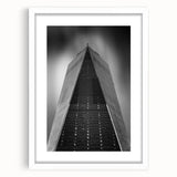 Abstract art print of NYC skyline in muted gray and blue tones on a white framed poster, suitable for dining room decor.