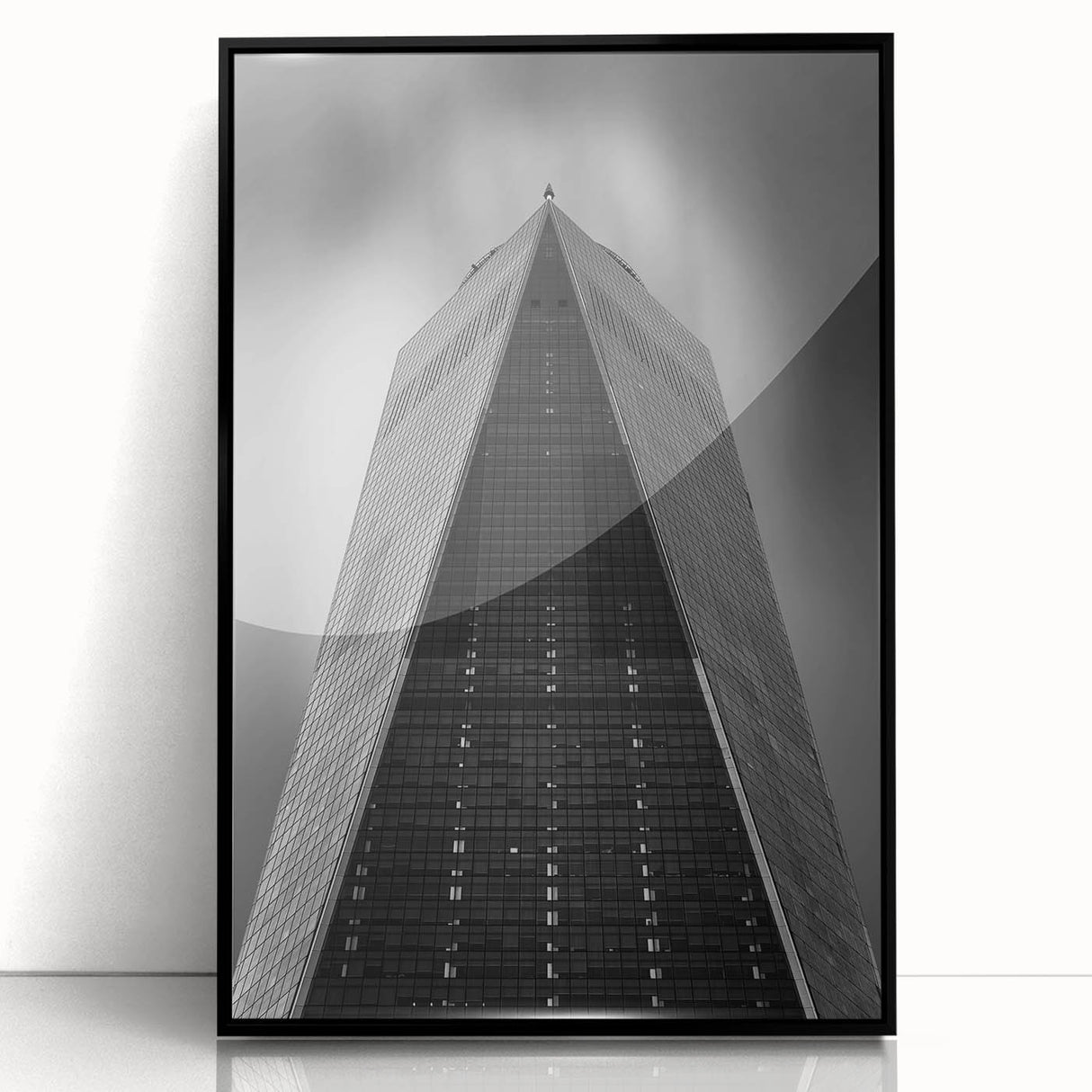 Large abstract wall art depicting the NYC skyline in muted gray and blue tones on a framed acrylic panel.