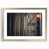 Textured abstract art print of Wall Street in muted grays and blues on a framed silver mat, suited for bedroom decor.