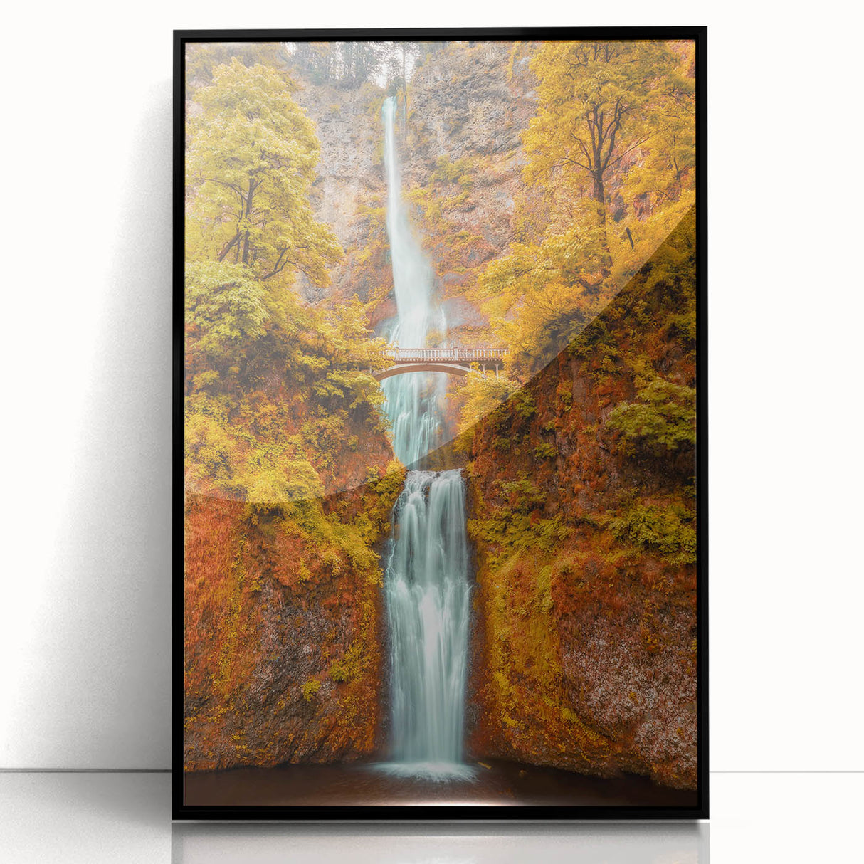 Large abstract wall art of Multnomah Falls in muted green and blue tones, framed in black acrylic.