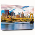 Large abstract depiction of the Pittsburgh skyline in muted gray and blue tones on acrylic glass.