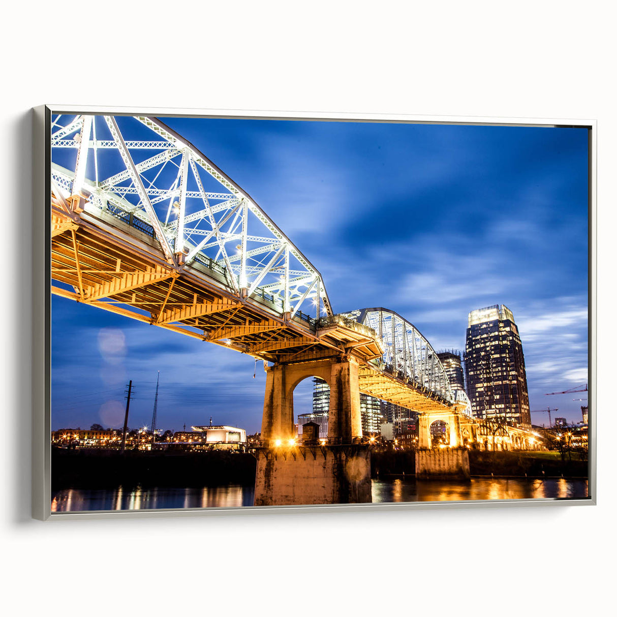 Framed canvas of Nashville landscape in vibrant colors on a black background, suitable for office decor.
