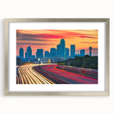 Textured art print of abstract Dallas skyline in muted blue and gray, framed in silver, ideal for bedroom art.