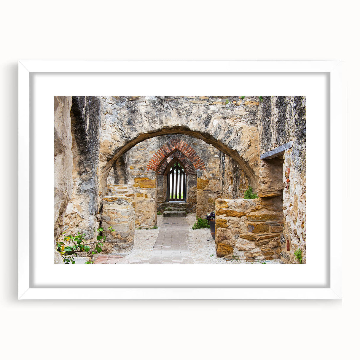 Abstract art print of San Antonio skyline in muted blue and gray tones on a framed white mat, suitable for dining room decor.