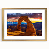 Extra large wall art depicting abstract Arches National Park in textured hues of orange and red, framed in gold.