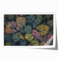 Rolled print showcasing a vibrant landscape design featuring lush greenery and serene mountains, packaged securely in a protective cardboard tube for safe shipping.