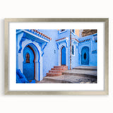 Abstract art print of a Moroccan landscape in muted earth tones, framed with a silver mat, suitable for dining room decor.