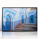 Large abstract wall art featuring a Moroccan landscape in muted earth tones, framed in black acrylic.