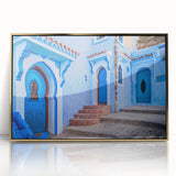 Mid-century modernist art depicting a Moroccan landscape in earth tones on a framed acrylic panel.