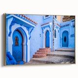 Framed canvas landscape art painting depicting a Moroccan scenery in vibrant gold and black tones.