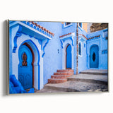Vintage poster art of a Moroccan landscape in vibrant colors on a framed canvas, ideal for living room decor.