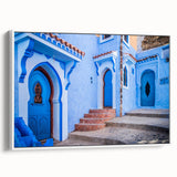 Framed canvas of a vintage-style Moroccan landscape in muted earth tones, ideal for bedroom wall decor.