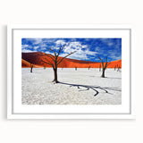 Extra large abstract art print of African scenery in textured style, featuring muted earth tones, framed in white.