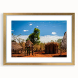 Extra large wall art depicting an abstract African landscape in textured gold and earth tones, framed with a mat.