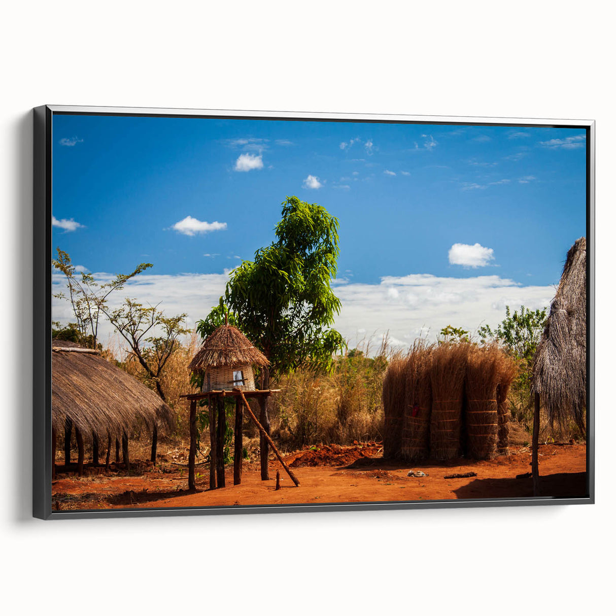 Black and white framed canvas featuring a vintage-style landscape painting of Zambia, ideal for bedroom decor.
