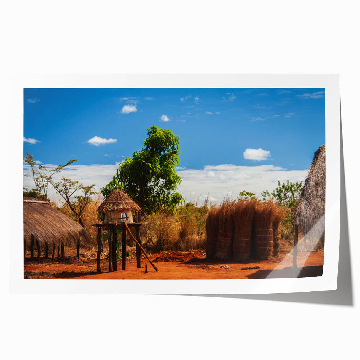 Extra large rolled print featuring a serene African landscape with lush greenery and a distant mountain.