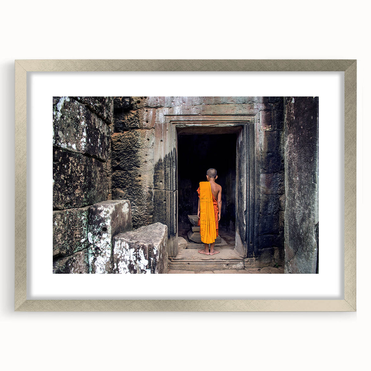 Textured abstract art print depicting Cambodian scenery in muted earth tones, framed with a silver mat.