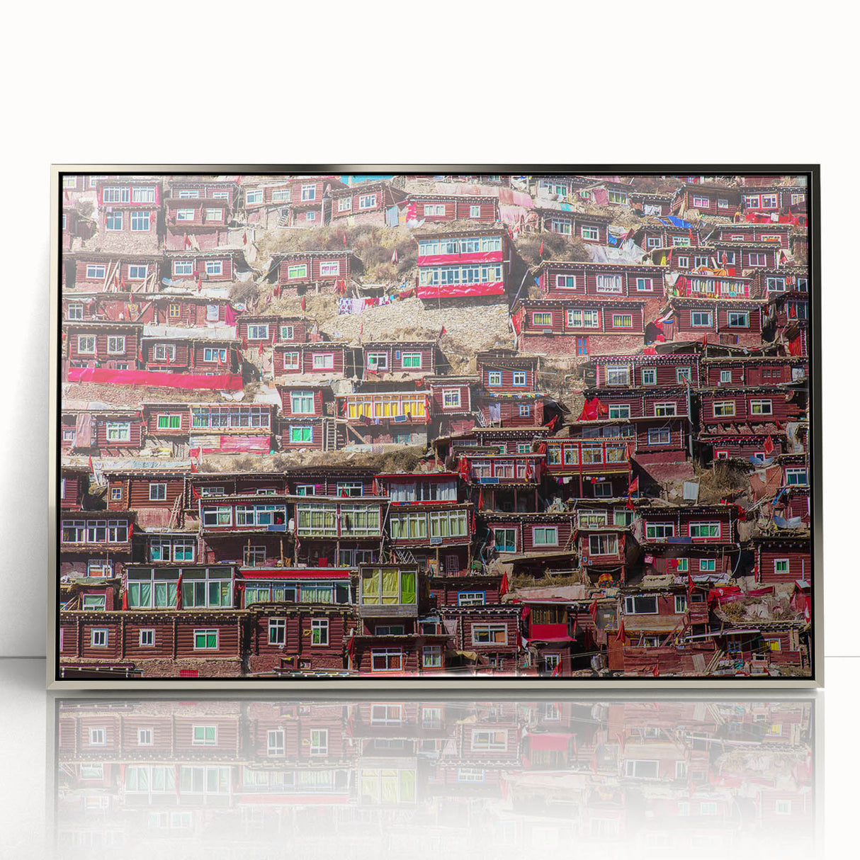 Mid-century modernist art depicting a serene Tibetan landscape in muted earth tones on a silver-framed acrylic print.