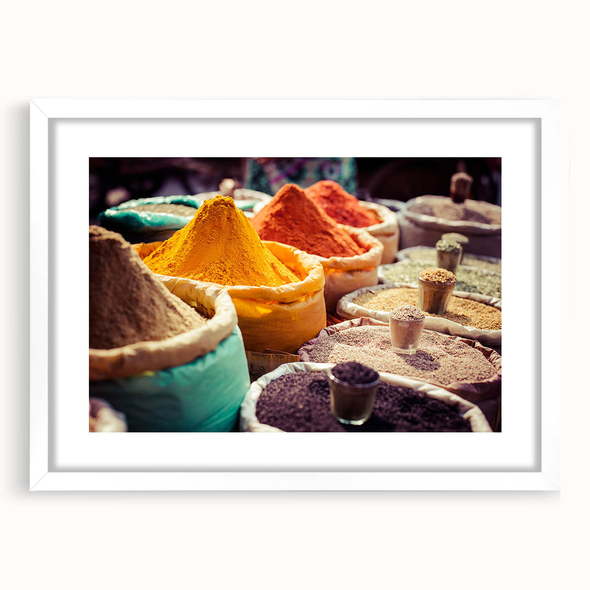 Abstract art print depicting a stylized Indian landscape in earthy tones, framed with a white mat.