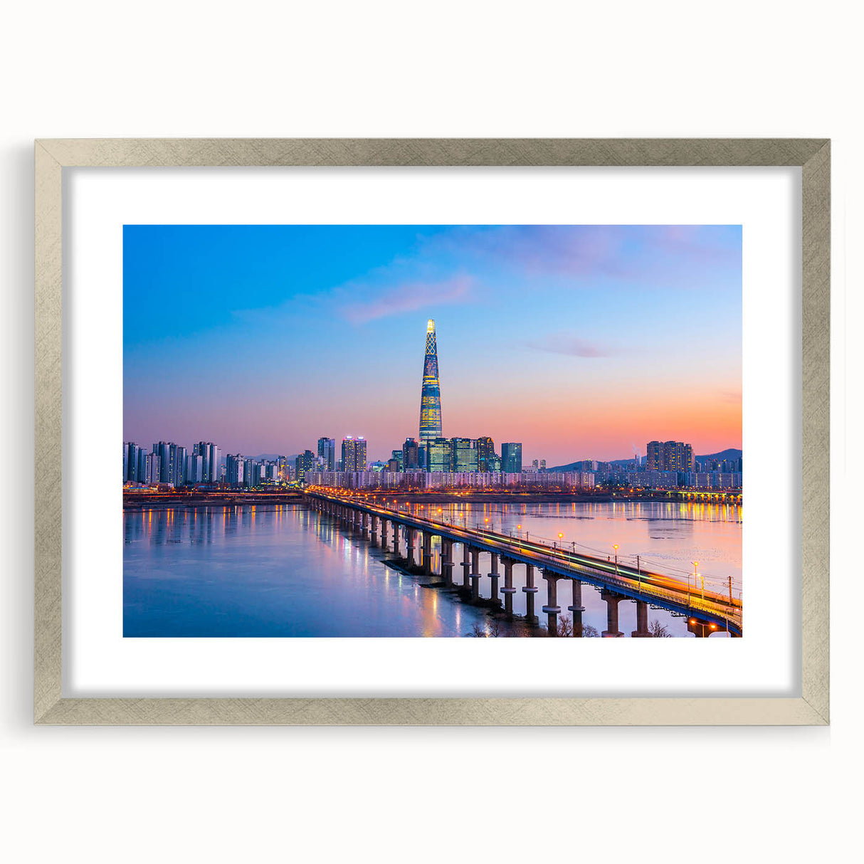 Textured art print of abstract Seoul skyline in muted grays and blues, framed in silver, ideal for bedroom decor.