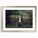 Textured art print of abstract, muted earth tones, framed in silver, ideal for bedroom ambiance.