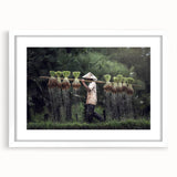 Abstract art print of a serene Thai landscape in soft blue and green hues, framed in white.