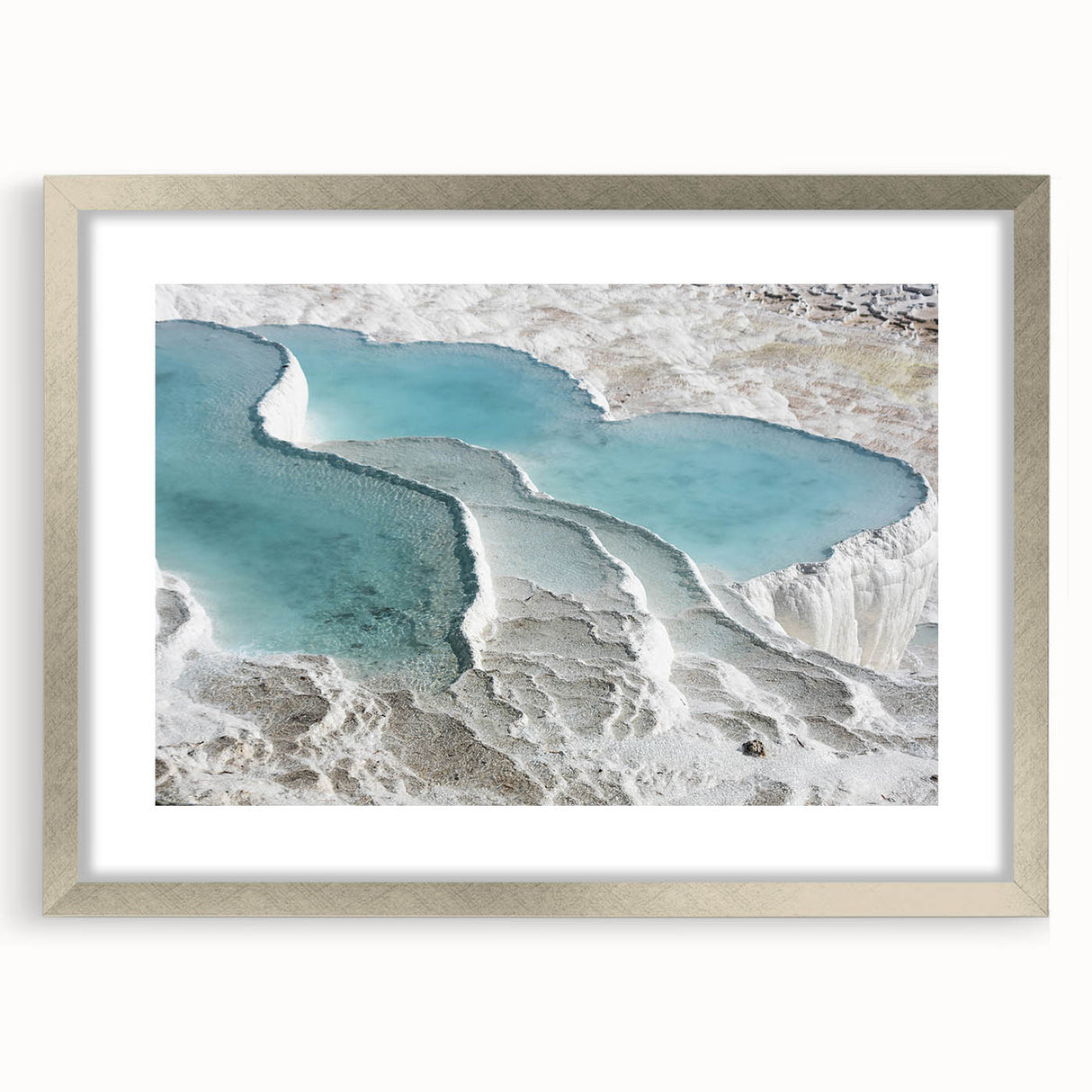 Textured art print of an abstract Turkish landscape in muted earth tones, framed in silver, ideal for bedroom decor.
